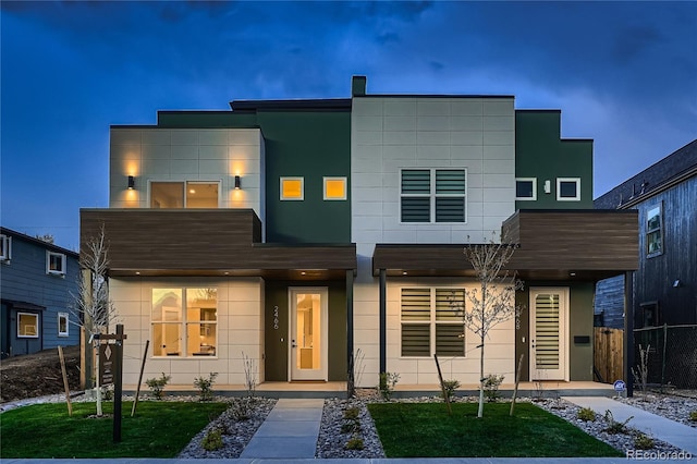 contemporary home with fence
