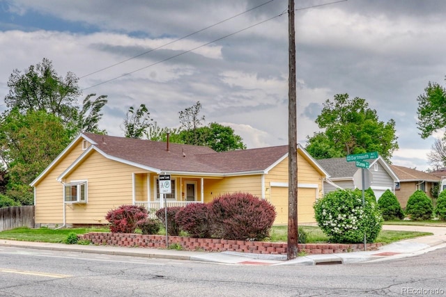 3100 S Corona St, Englewood, CO 80113 - single story home with a garage, covered porch, and driveway