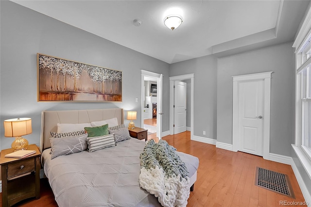 bedroom with wood-type flooring