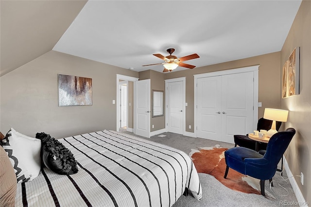 carpeted bedroom with ceiling fan and lofted ceiling