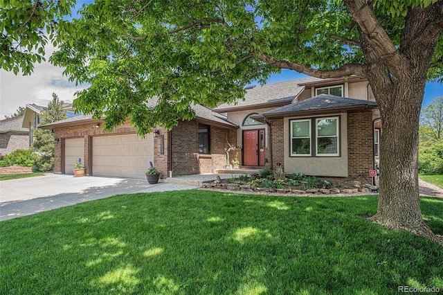 1152 Clubhouse Dr, Broomfield, CO 80020 - view of front of home with a garage, driveway, a front yard, and brick siding