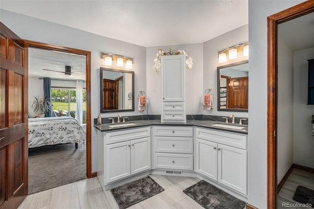1152 Clubhouse Dr, Broomfield, CO 80020 - ensuite bathroom with double vanity, a ceiling fan, and baseboards