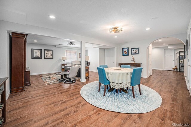1152 Clubhouse Dr, Broomfield, CO 80020 - dining room with arched walkways, wood finished floors, baseboards, and recessed lighting