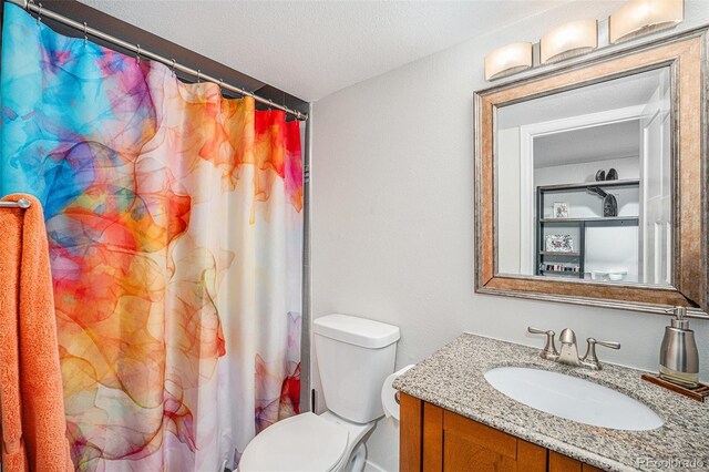 1152 Clubhouse Dr, Broomfield, CO 80020 - full bath featuring vanity, toilet, and a shower with shower curtain