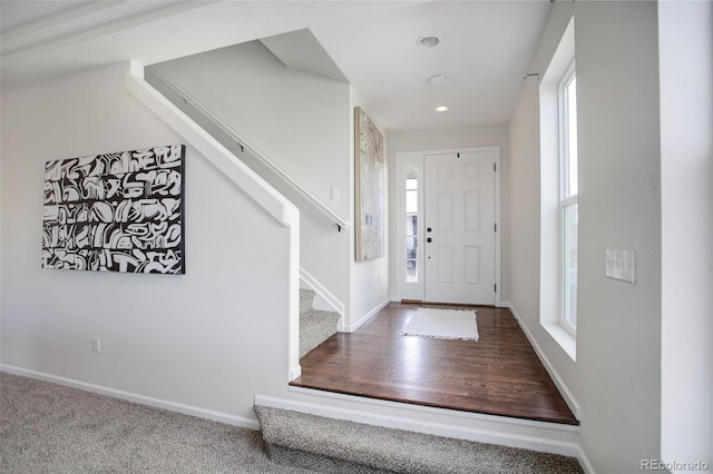 entrance foyer featuring carpet