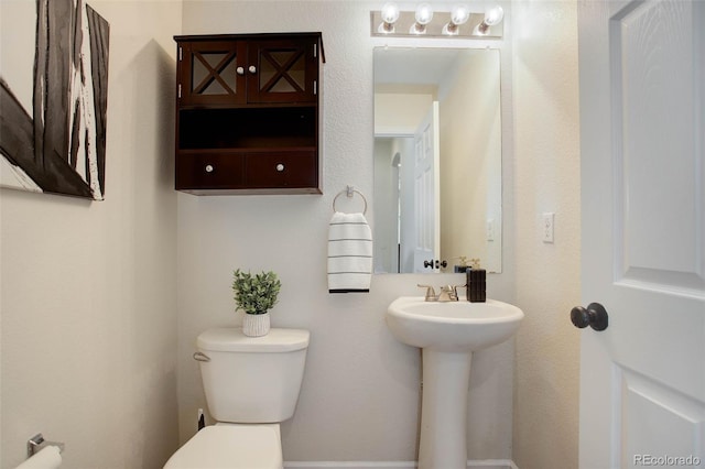 bathroom featuring toilet