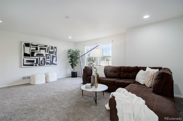 living room featuring dark colored carpet