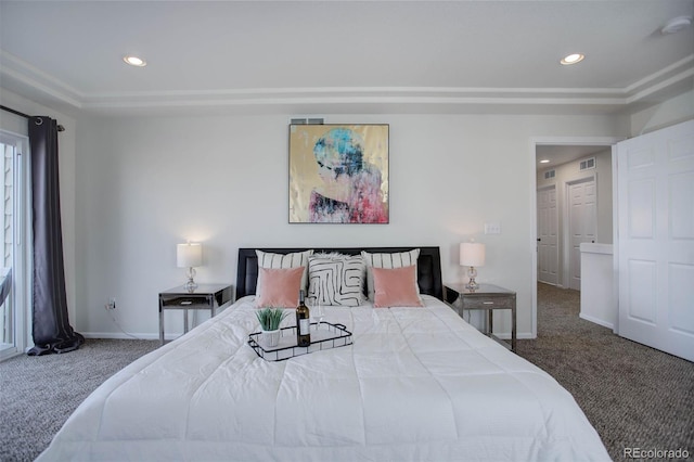 bedroom featuring dark carpet and a raised ceiling