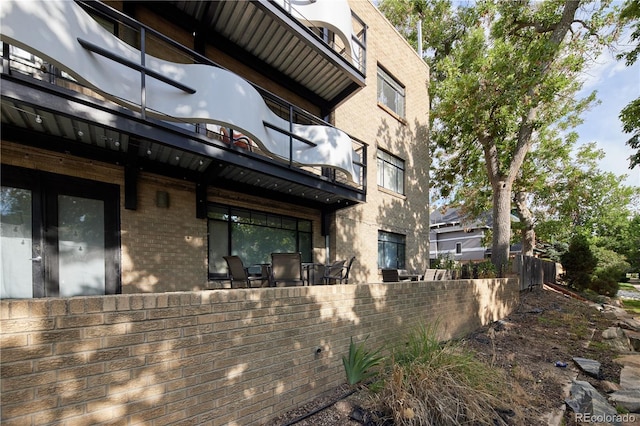 500 E 11th Ave Unit 201, Denver, CO 80203 - rear view of house with brick siding and a balcony