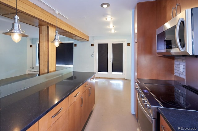 500 E 11th Ave Unit 201, Denver, CO 80203 - kitchen with stainless steel appliances, tasteful backsplash, hanging light fixtures, dark stone countertops, and french doors