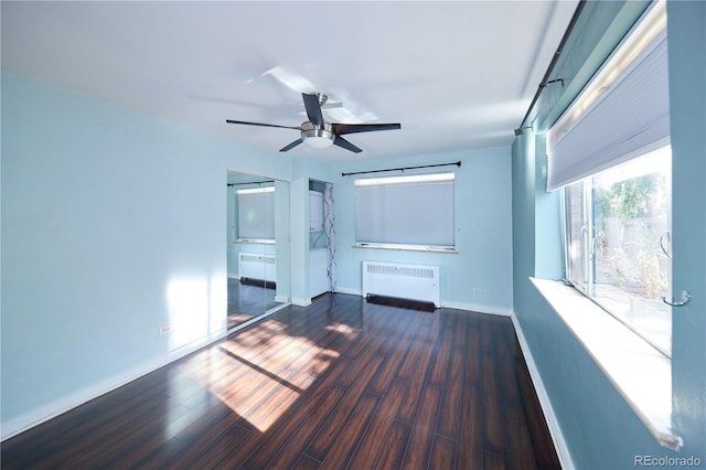 500 E 11th Ave Unit 201, Denver, CO 80203 - unfurnished living room with radiator, wood finished floors, and a ceiling fan