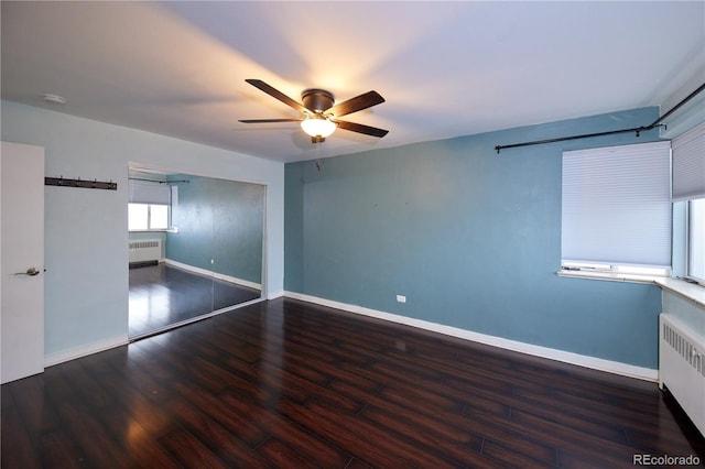 500 E 11th Ave Unit 201, Denver, CO 80203 - unfurnished room featuring radiator heating unit, a ceiling fan, and wood finished floors