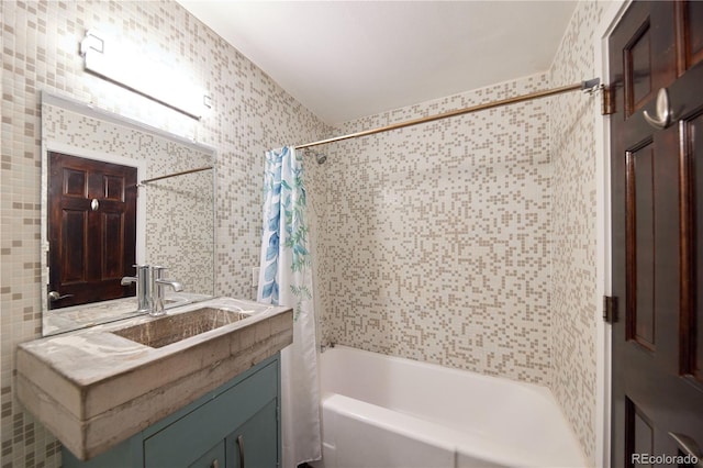 500 E 11th Ave Unit 201, Denver, CO 80203 - bathroom featuring shower / bathtub combination with curtain, vanity, and wallpapered walls