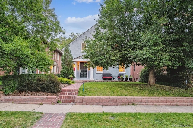 428 N Humboldt St, Denver, CO 80218 - obstructed view of property featuring a front yard
