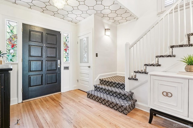 428 N Humboldt St, Denver, CO 80218 - entryway featuring stairs, light wood-type flooring, and crown molding
