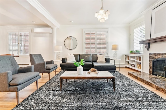 428 N Humboldt St, Denver, CO 80218 - living area featuring a wall mounted AC, light wood-style floors, crown molding, a chandelier, and a baseboard heating unit