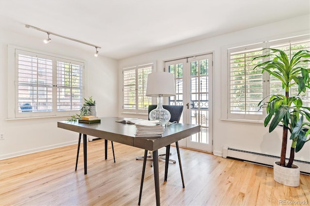 428 N Humboldt St, Denver, CO 80218 - office space featuring track lighting, wood finished floors, and a baseboard radiator