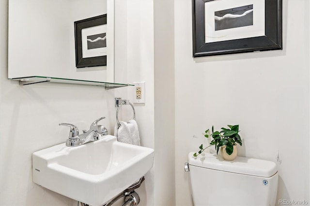 428 N Humboldt St, Denver, CO 80218 - half bathroom featuring a sink and toilet