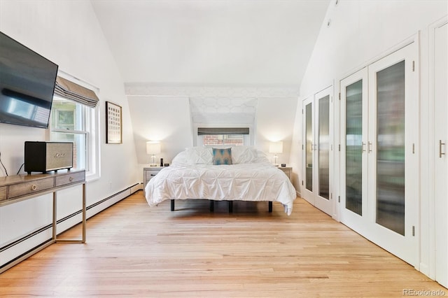 428 N Humboldt St, Denver, CO 80218 - bedroom featuring wood finished floors, a baseboard radiator, high vaulted ceiling, and french doors