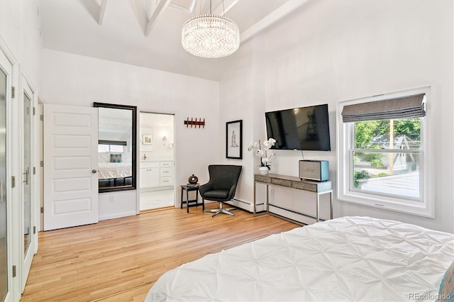 428 N Humboldt St, Denver, CO 80218 - bedroom featuring a high ceiling, light wood-style floors, a chandelier, baseboard heating, and ensuite bathroom
