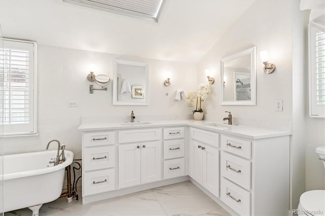 428 N Humboldt St, Denver, CO 80218 - bathroom with marble look tile flooring, double vanity, a soaking tub, and healthy amount of natural light
