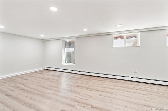 428 N Humboldt St, Denver, CO 80218 - basement featuring wood finished floors, recessed lighting, and a baseboard radiator