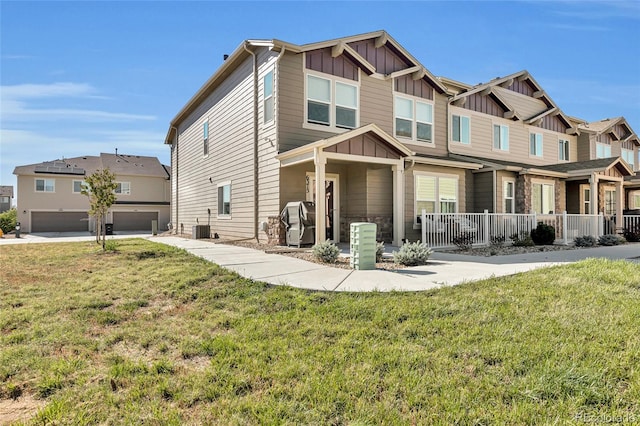 craftsman-style home with a garage and a front yard