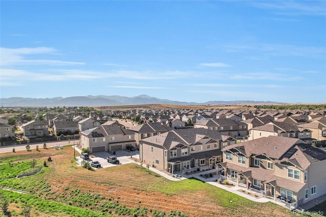 birds eye view of property featuring a mountain view