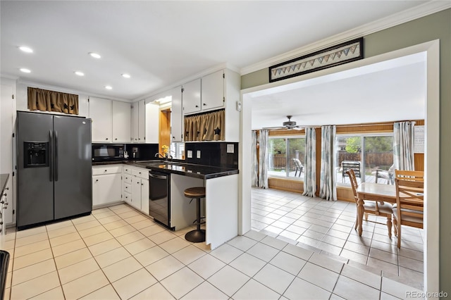 kitchen with black appliances, ornamental molding, dark countertops, recessed lighting, and ceiling fan