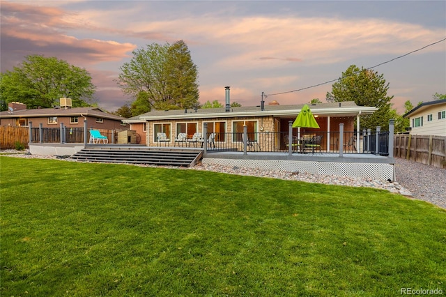 back of house featuring a wooden deck