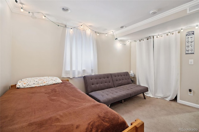 bedroom featuring carpet floors, crown molding, and baseboards