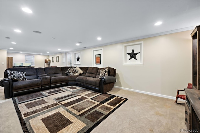 living area with light colored carpet, recessed lighting, crown molding, and baseboards