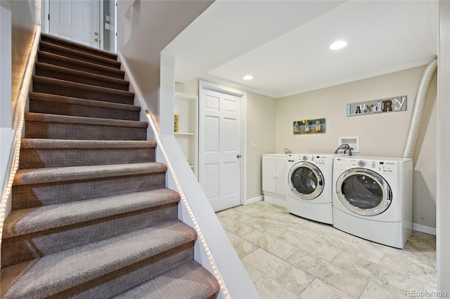 laundry room with cabinet space, washing machine and clothes dryer, baseboards, and recessed lighting