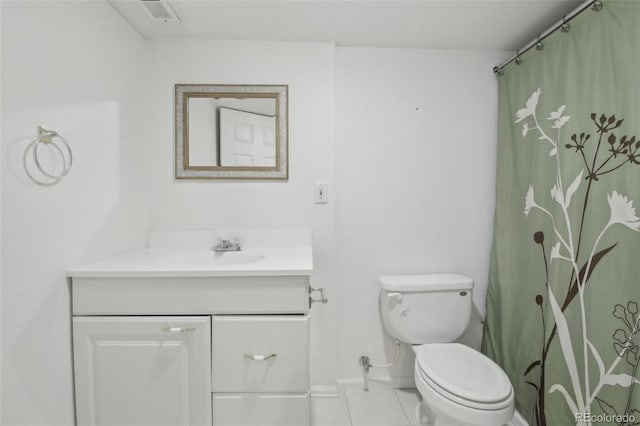 bathroom featuring baseboards, visible vents, toilet, tile patterned floors, and vanity