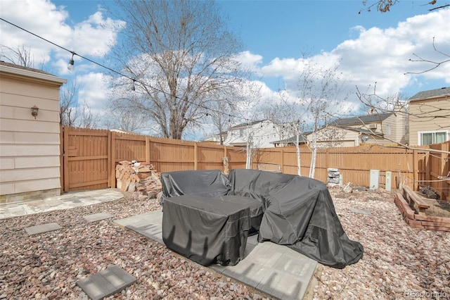 view of yard featuring a patio area and a fenced backyard