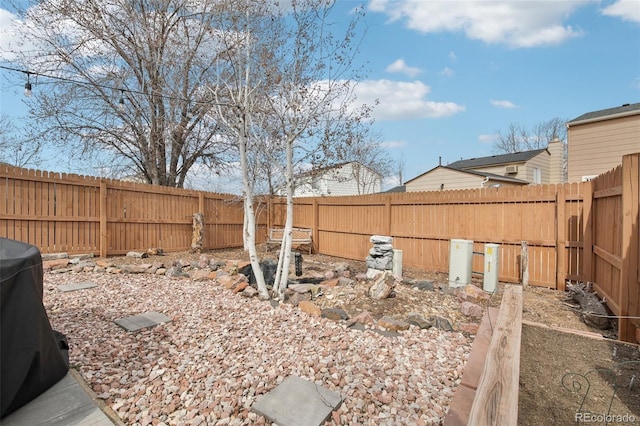 view of yard with a fenced backyard