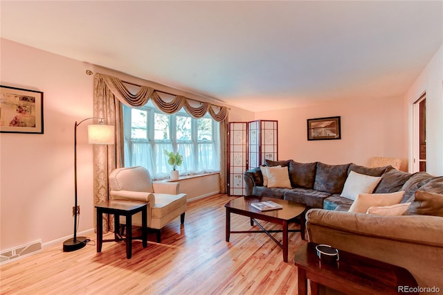 living room with light hardwood / wood-style flooring