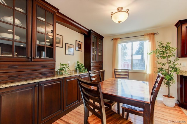 dining area with light hardwood / wood-style flooring