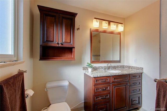 bathroom with vanity and toilet