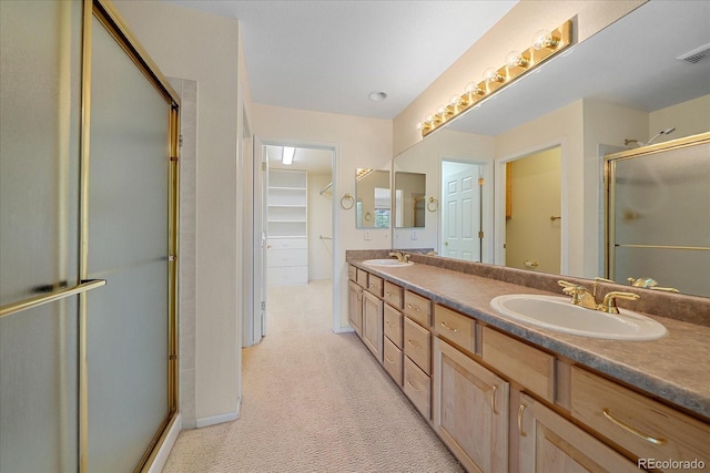 7912 S Buchanan Way, Aurora, CO 80016 - bathroom with a shower stall, double vanity, and a spacious closet