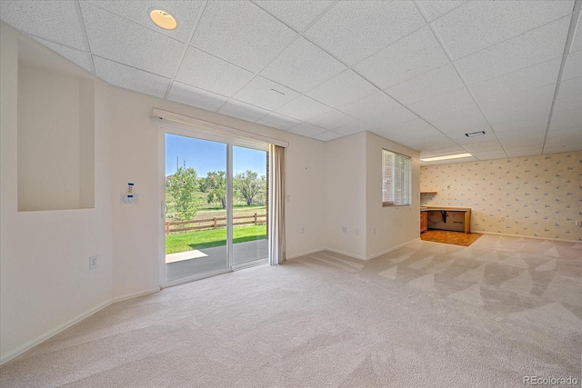 7912 S Buchanan Way, Aurora, CO 80016 - unfurnished living room with carpet flooring and a drop ceiling
