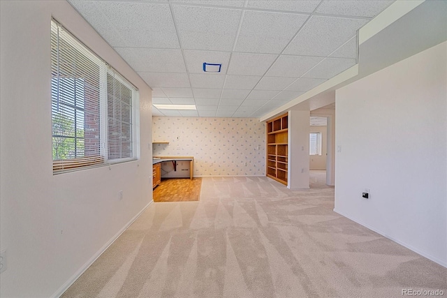 7912 S Buchanan Way, Aurora, CO 80016 - below grade area with light colored carpet and a drop ceiling