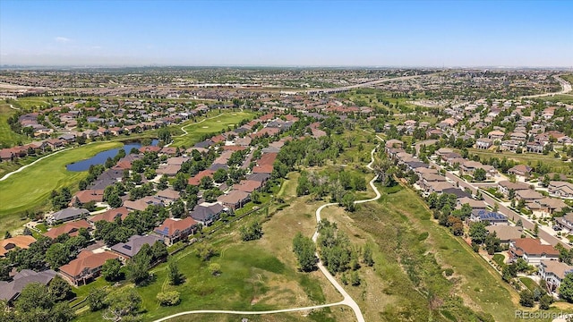 7912 S Buchanan Way, Aurora, CO 80016 - aerial view of property and surrounding area featuring nearby suburban area, a large body of water, and a golf club