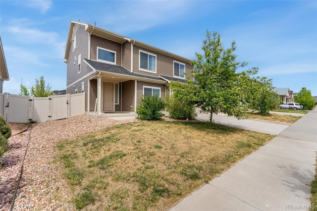 19047 Randolph Pl, Denver, CO 80249 - view of front of property with a front yard, fence, driveway, and a gate