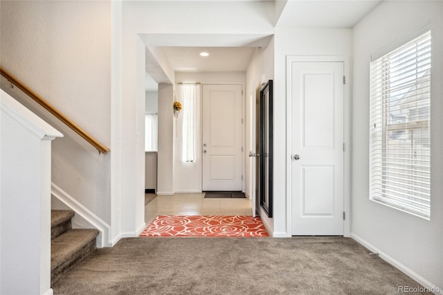 19047 Randolph Pl, Denver, CO 80249 - carpeted entryway with baseboards and stairway