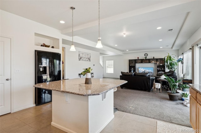 19047 Randolph Pl, Denver, CO 80249 - kitchen featuring a center island, light tile patterned floors, a breakfast bar, black fridge with ice dispenser, and light colored carpet