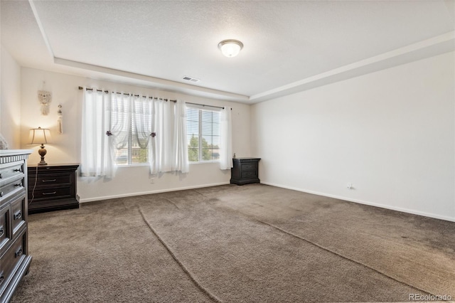 19047 Randolph Pl, Denver, CO 80249 - unfurnished bedroom with a tray ceiling, carpet, and baseboards