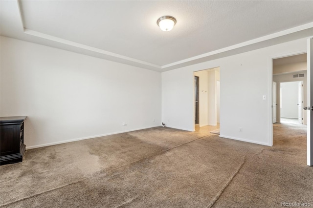 19047 Randolph Pl, Denver, CO 80249 - interior space featuring a tray ceiling, baseboards, and visible vents