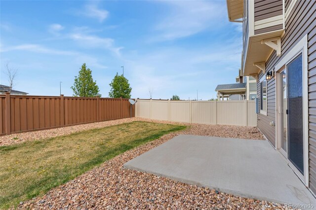 19047 Randolph Pl, Denver, CO 80249 - view of yard featuring a fenced backyard and a patio