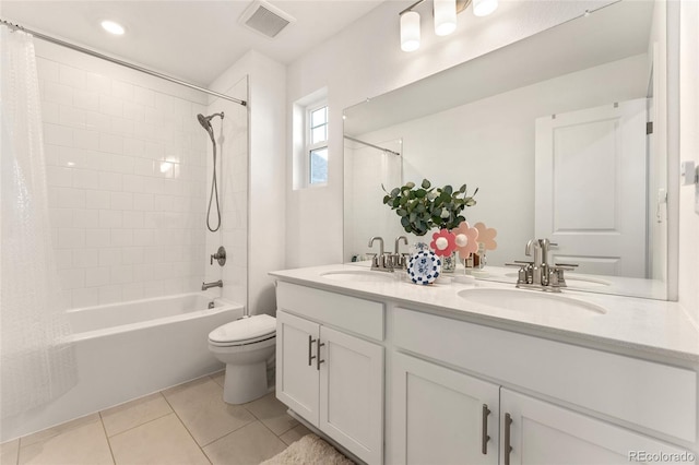 full bathroom featuring visible vents, a sink, toilet, and tile patterned floors